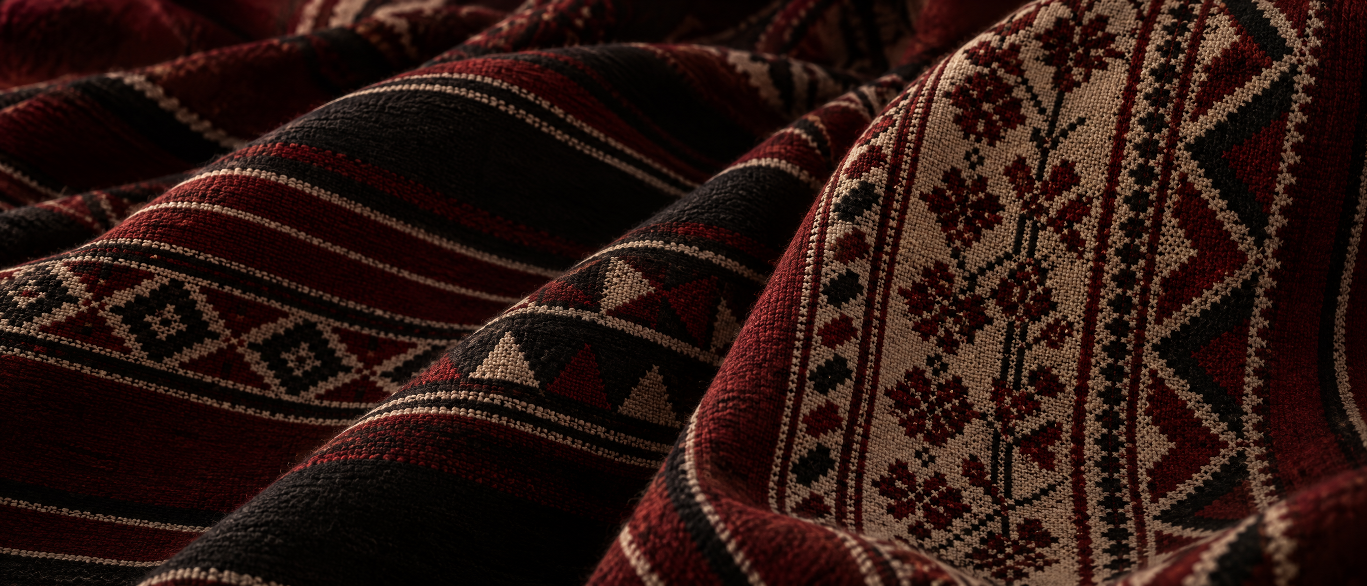 Close-up of hand-woven red, black and cream textile