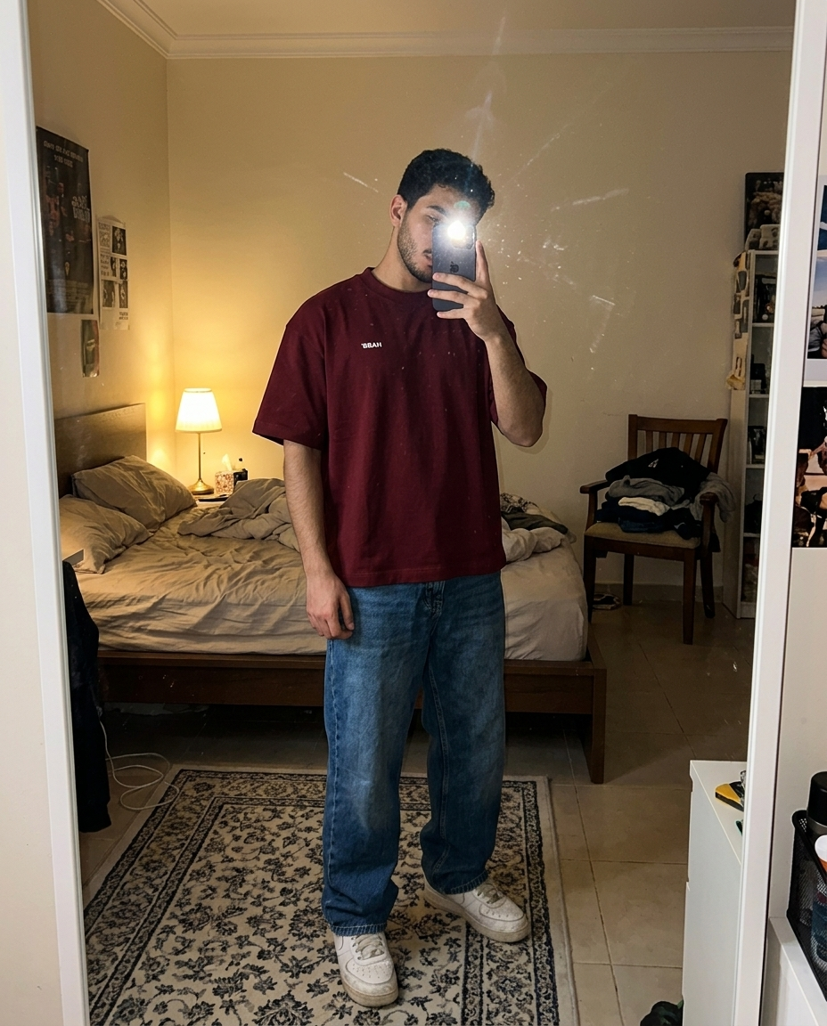 Mirror selfie in The Classics Tee, Wine Red front